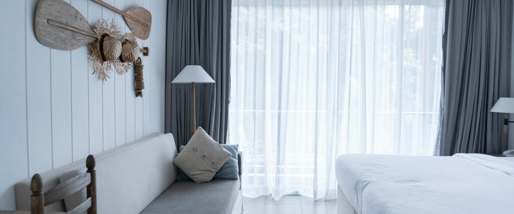 Modern bedroom in corporate rental with clean linens.